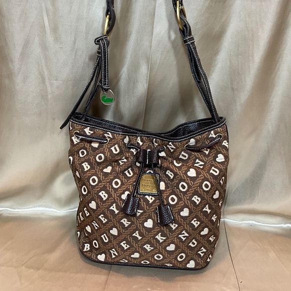 Dooney Burke bucket bag with signature brown & white print.8-17-H7Aa